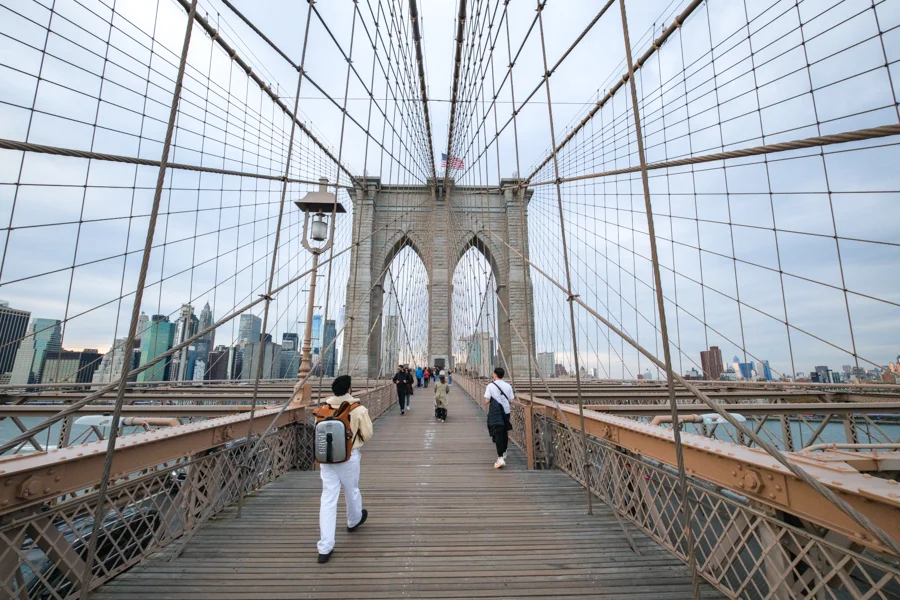 Walking across Brooklyn Bridge in New York City