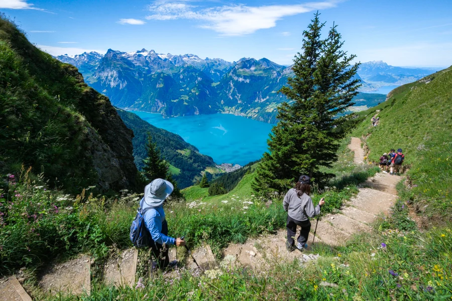 Hikers on the Stoos ridge best hikes in Switzerland