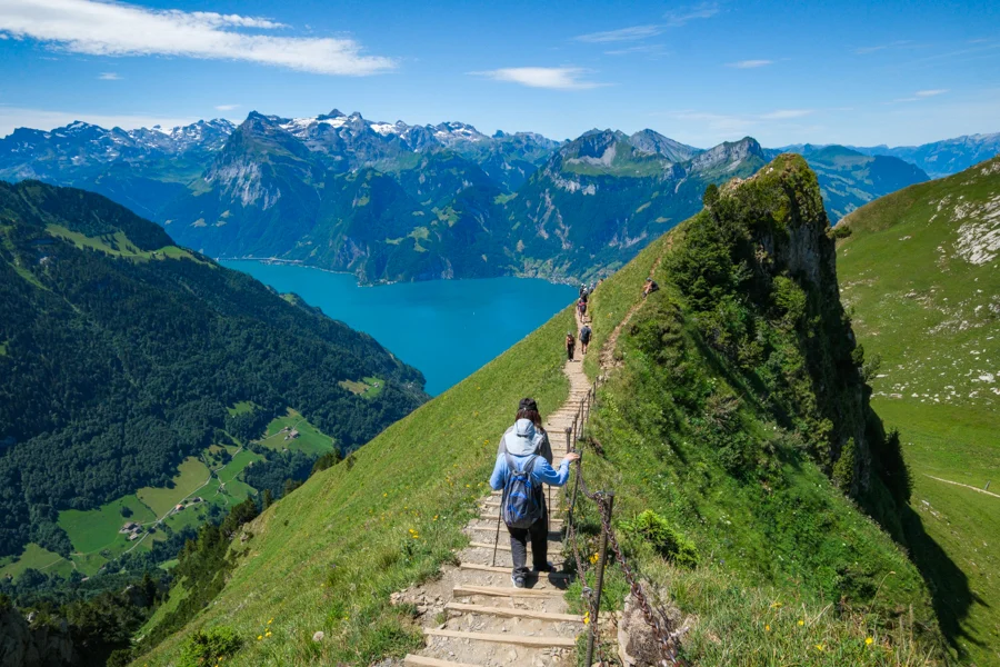 Hikers on the Stoos ridge best hikes in Switzerland